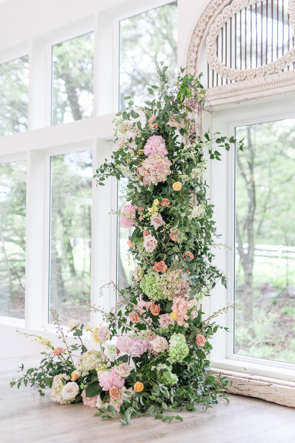 pastel floral arch for wedding