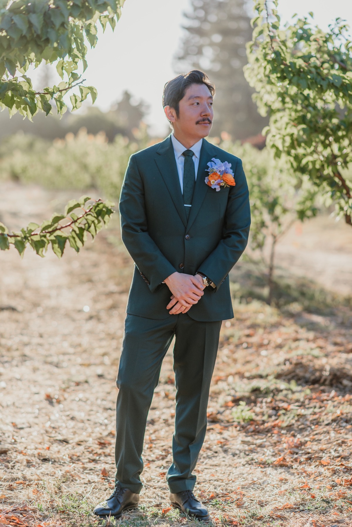 groom in green suit