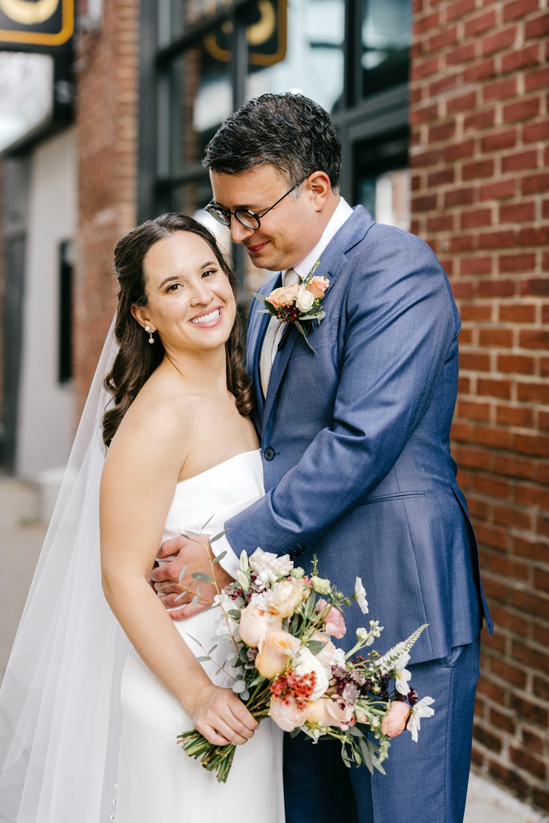 blue suit for groom with knitted tie