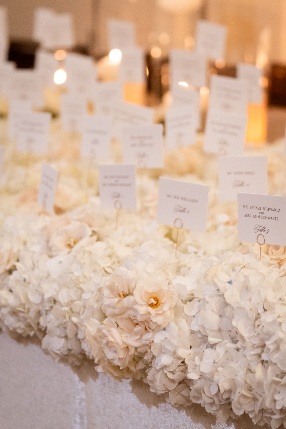 seating cards on bed of flowers