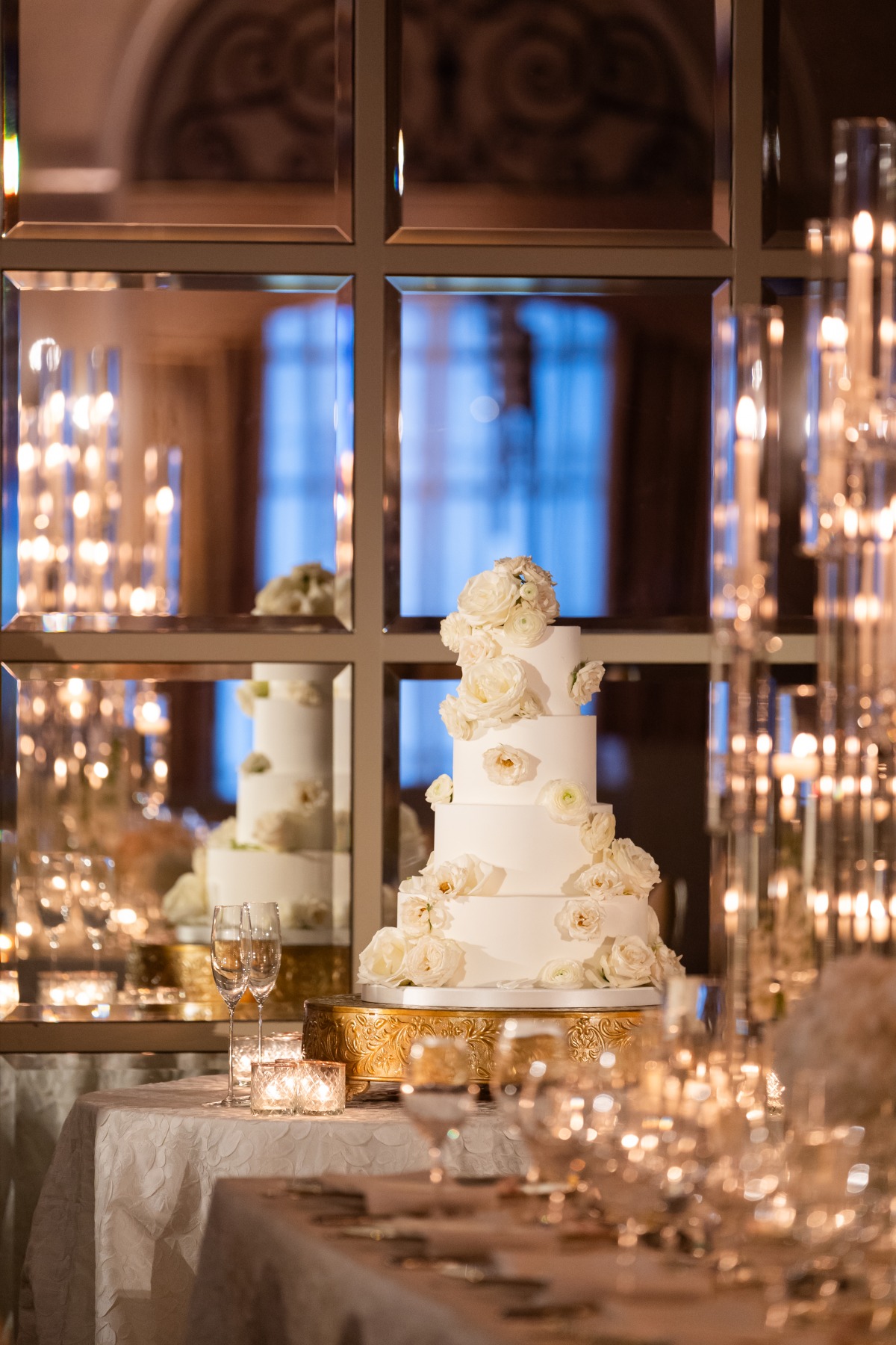four tier wedding cake with white antique roses