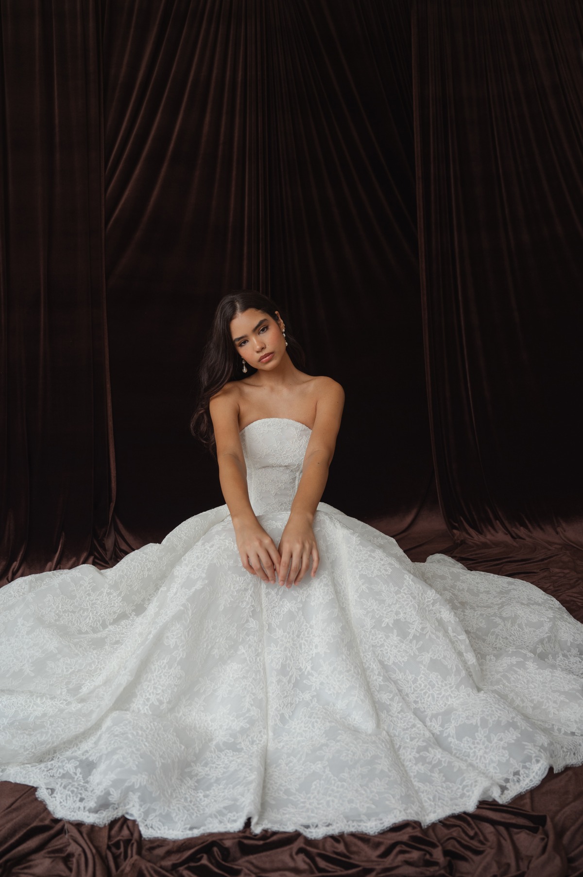 bride sitting in lace dress