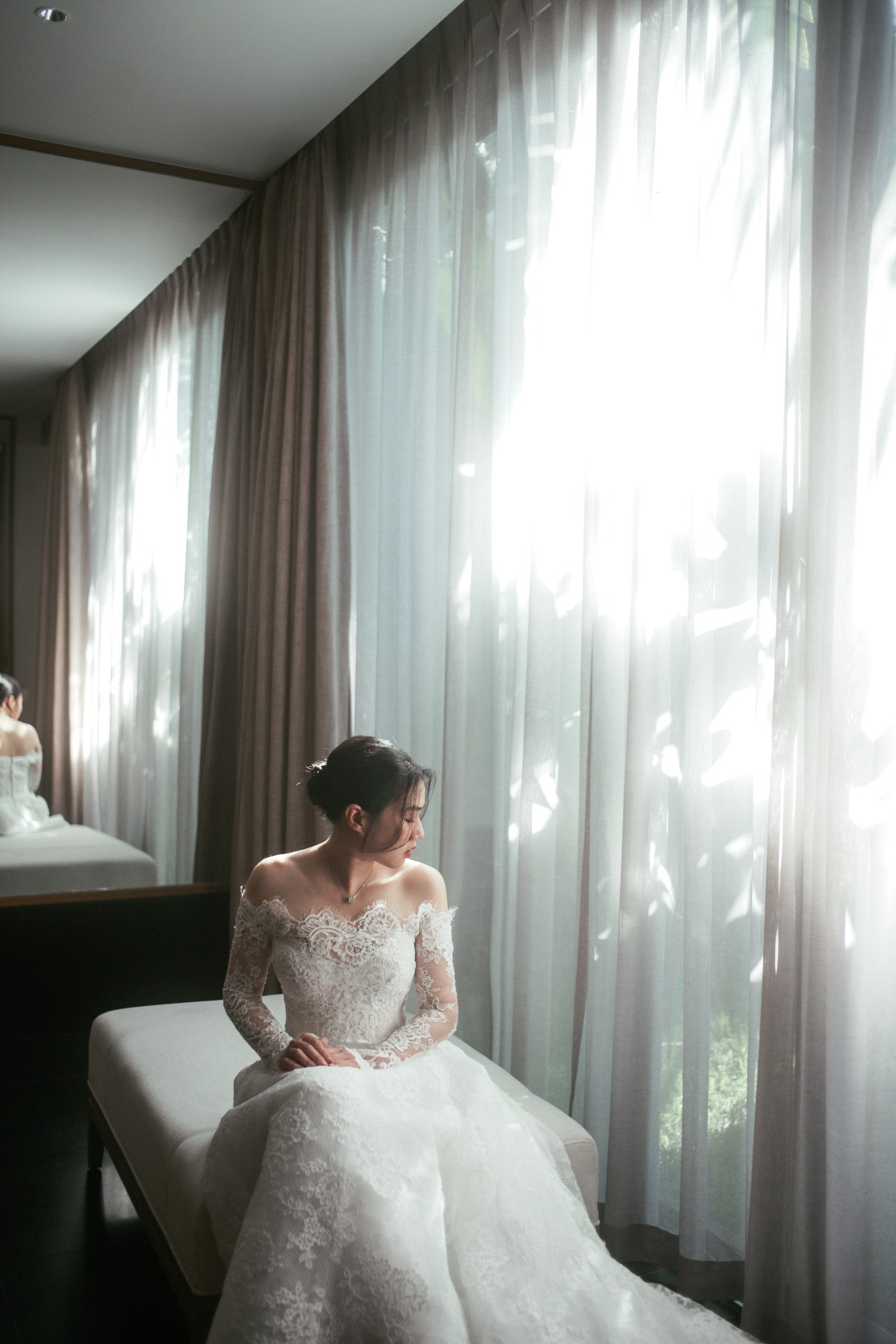 bride in long sleeve lace dress