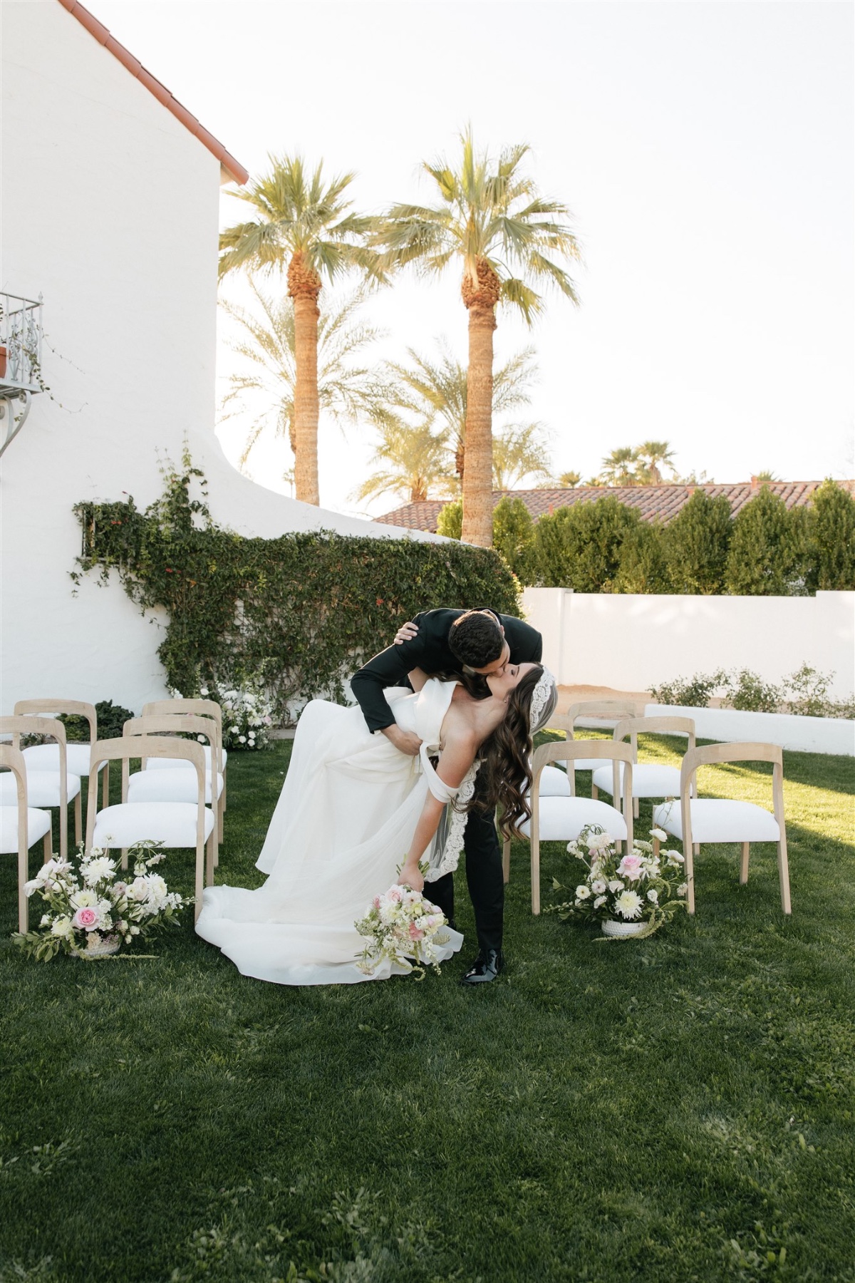 pink and white rose wedding ceremony floral arrangements