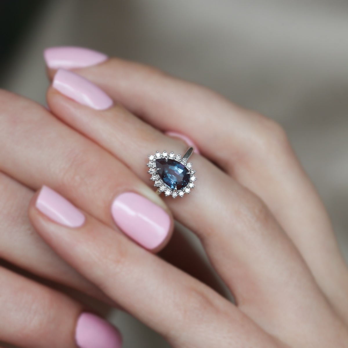 Pear shaped halo sapphire engagement ring