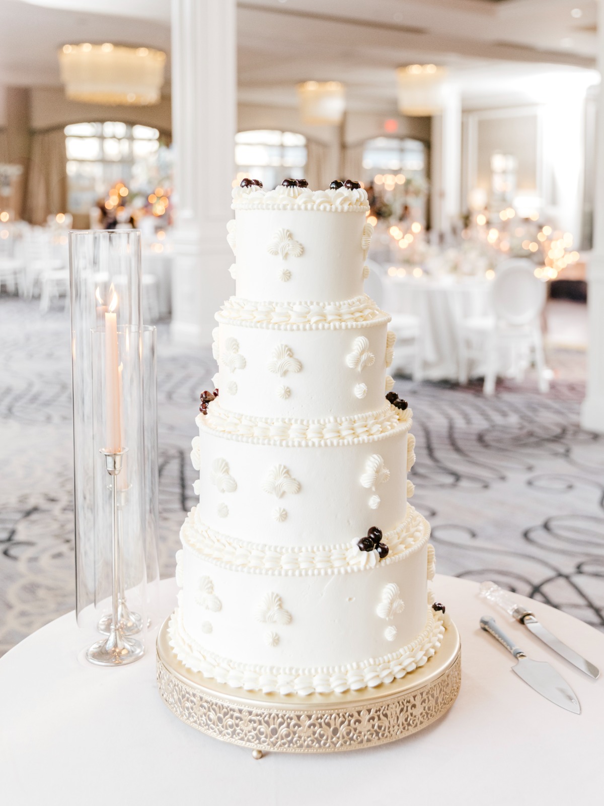 white lambeth wedding cake with black cherries