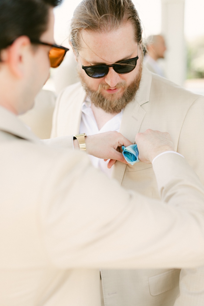 candid groom getting ready photos