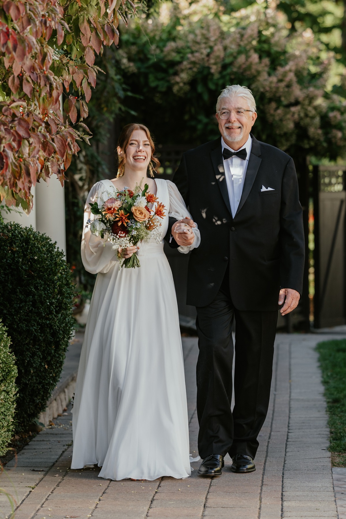 father of the bride walking her down the aisle