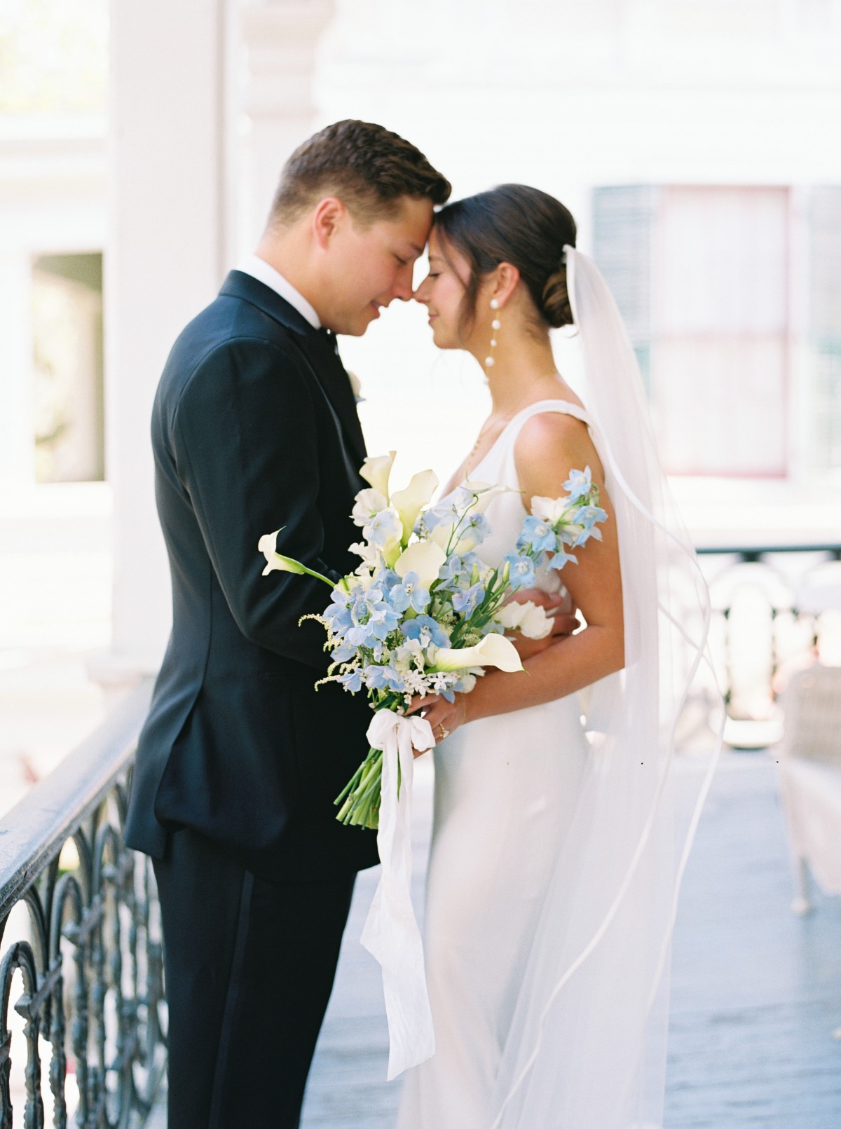 white cala lily and blue delphinium bouquet