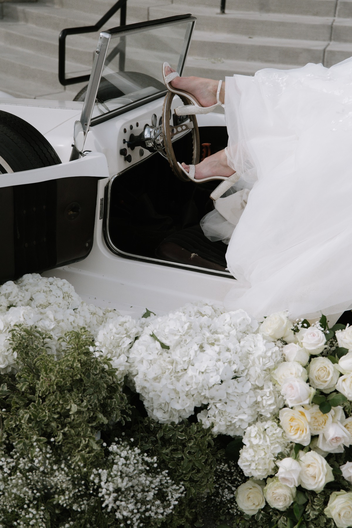 vintage car at wedding with flowers