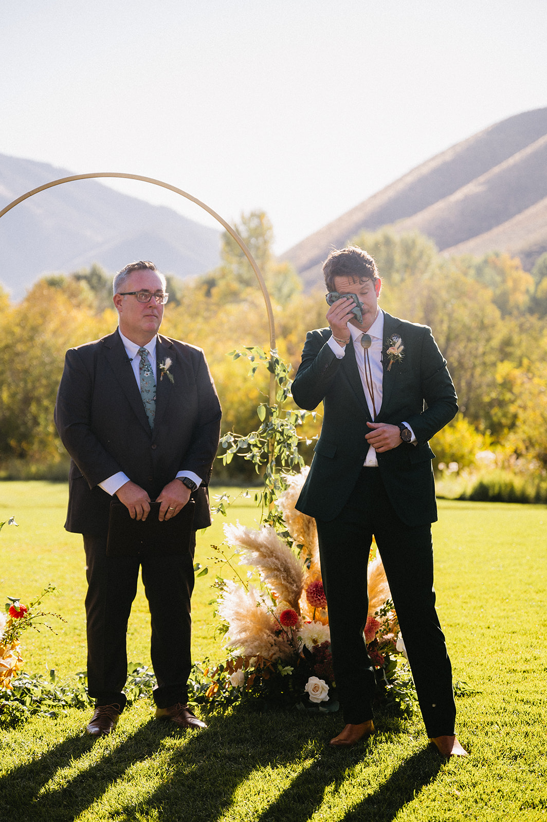 gold metal arch wedding ceremony