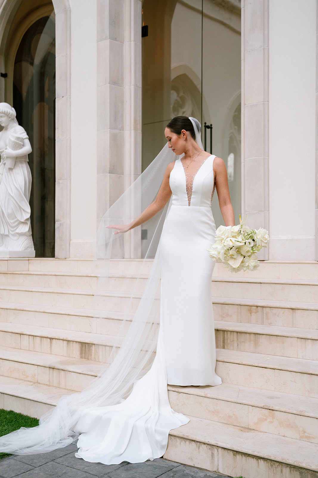 wedding dress with plunging neckline and crystal beading