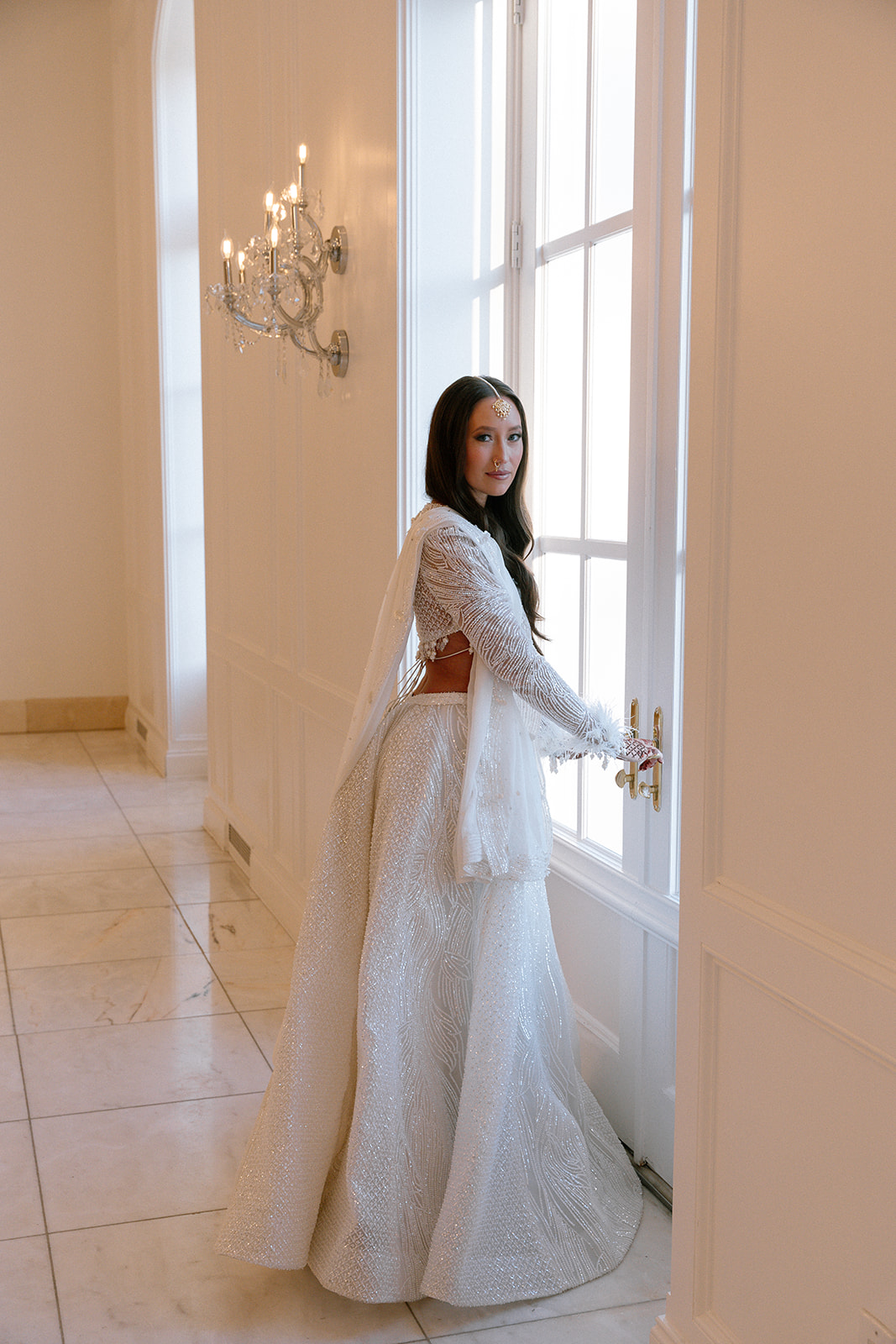 white lehenga with feathers