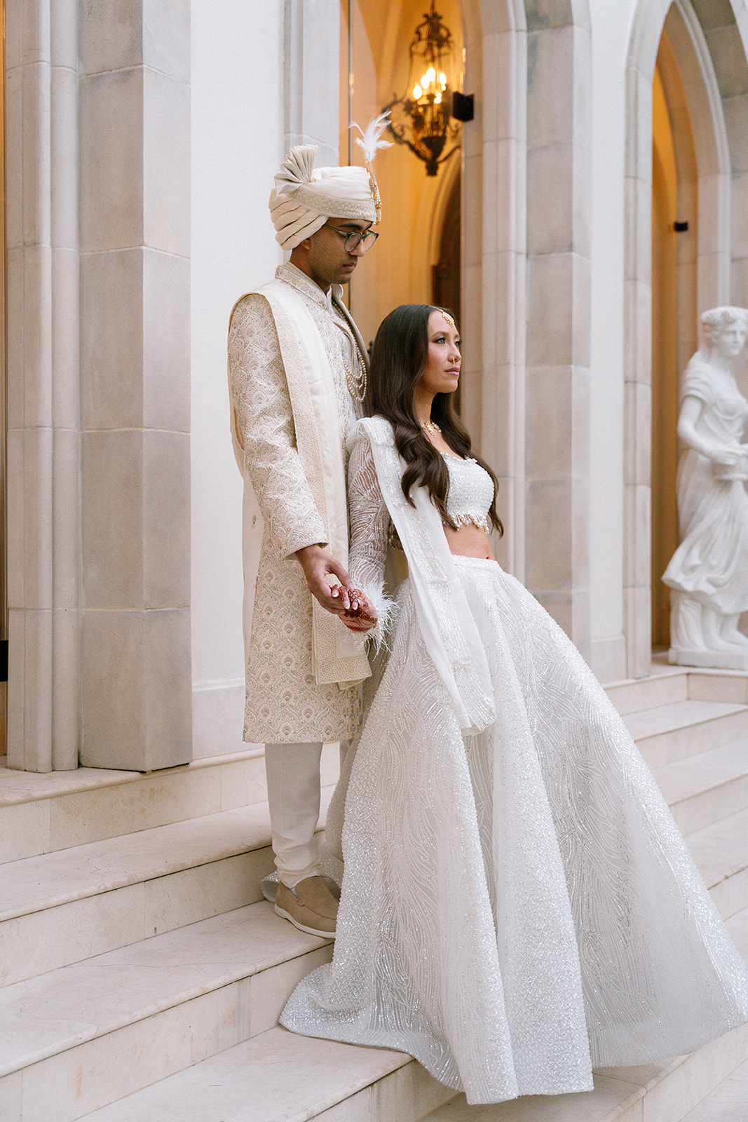indian wedding dress with feathers and pearls