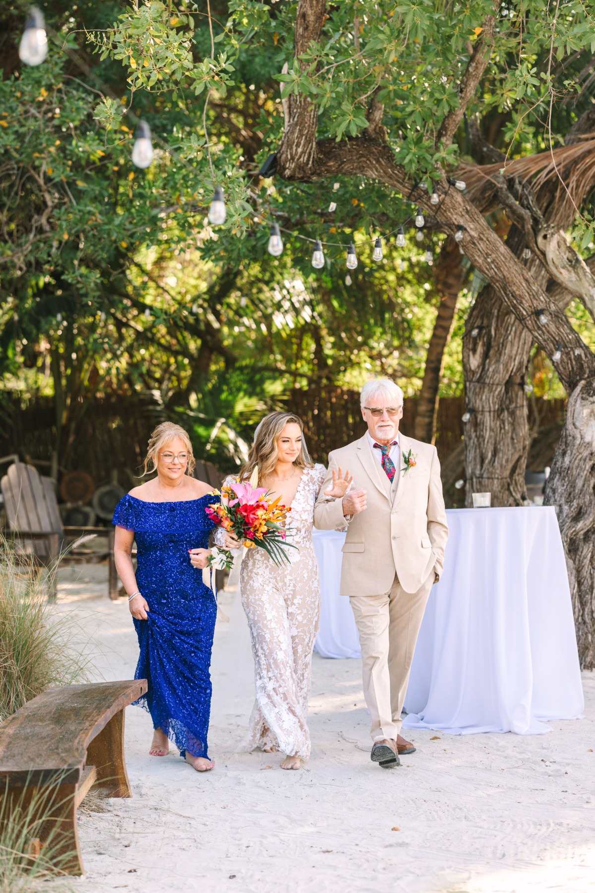 both parents walking bride down the aisle