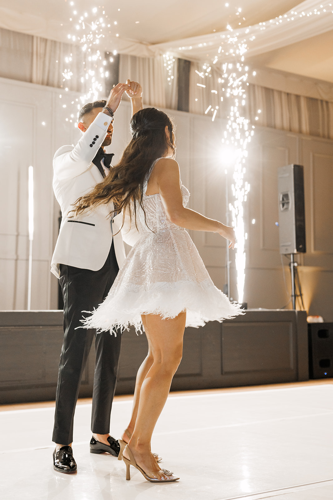 feather-trimmed reception dress