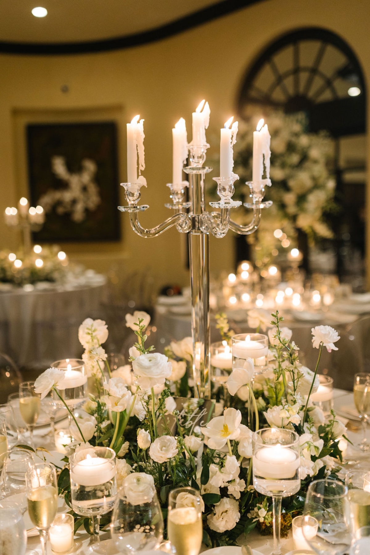 white floral centerpieces with candles for wedding