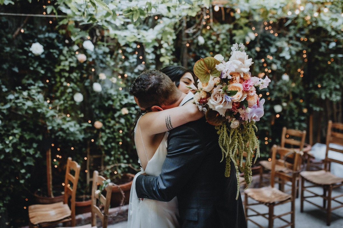 muted rainbow bouquet with dripping greenery