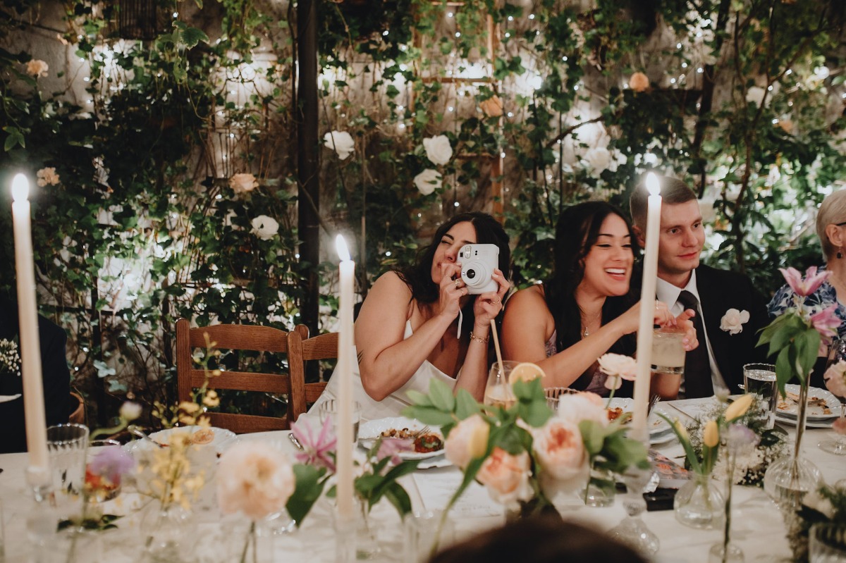 candlelit reception with polaroid camera