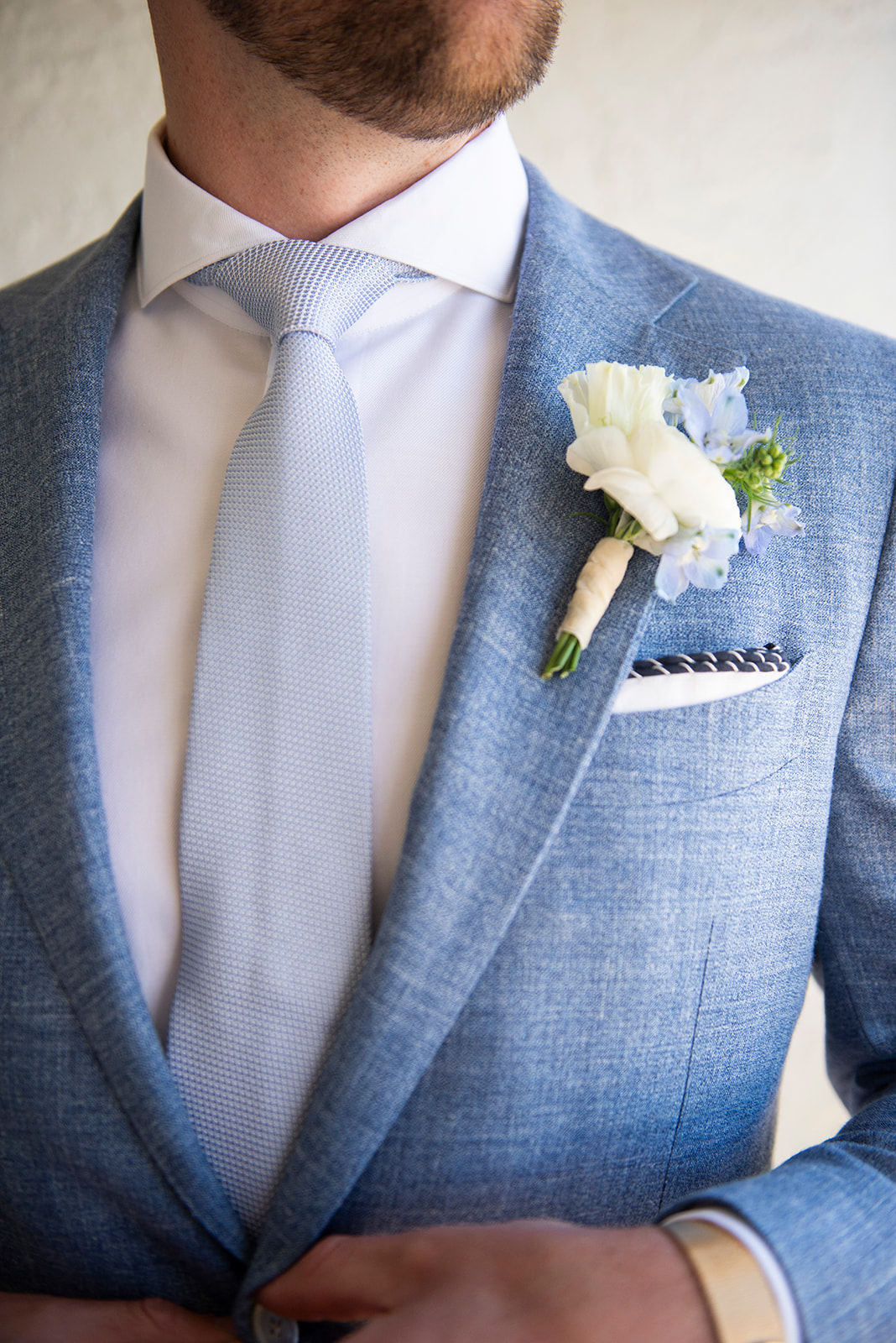 blue and white wedding look for groom