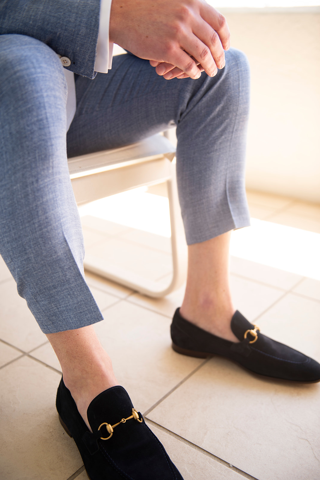 groom with black suede loafers