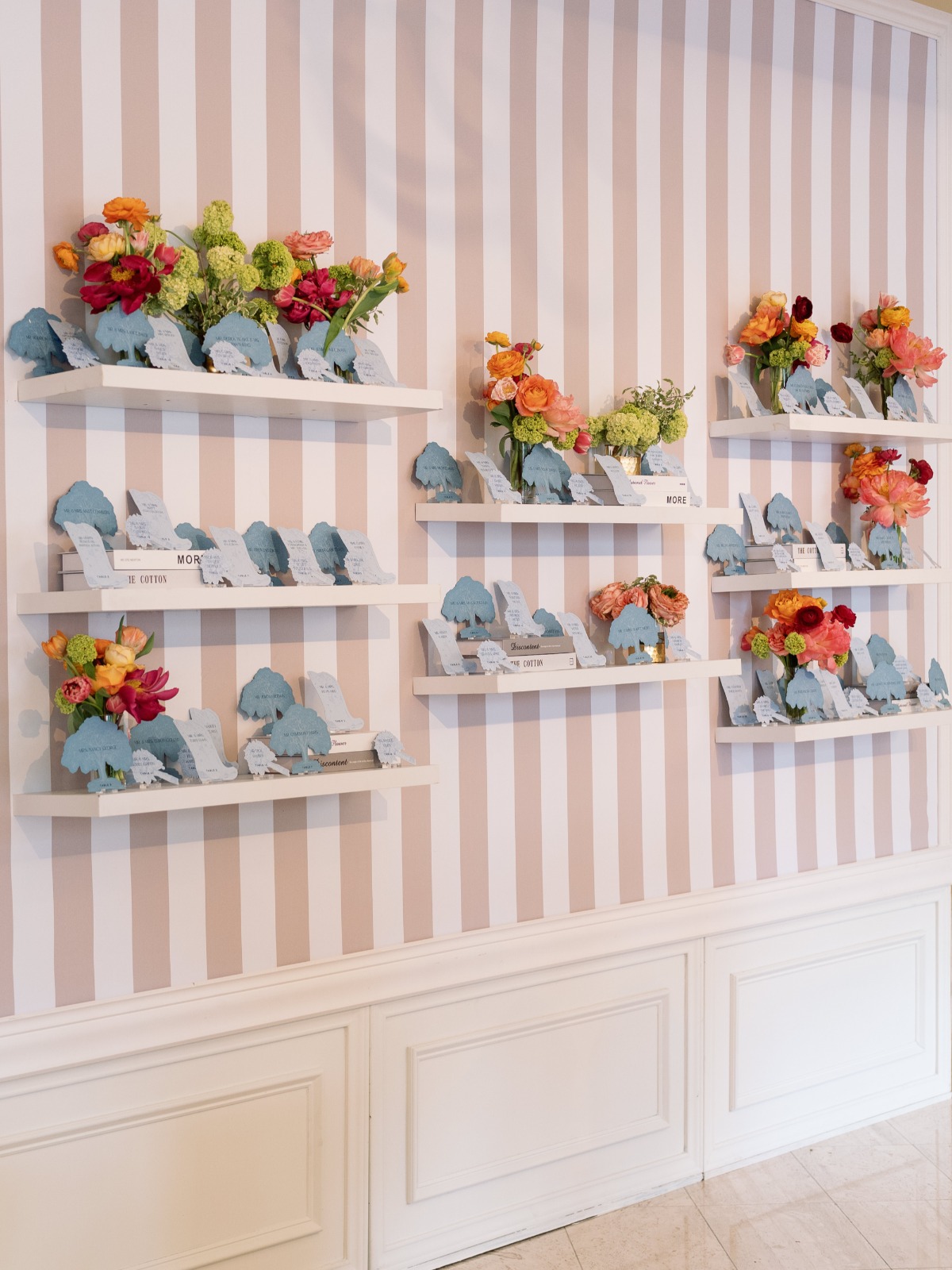 simple escort card bookshelf display for wedding