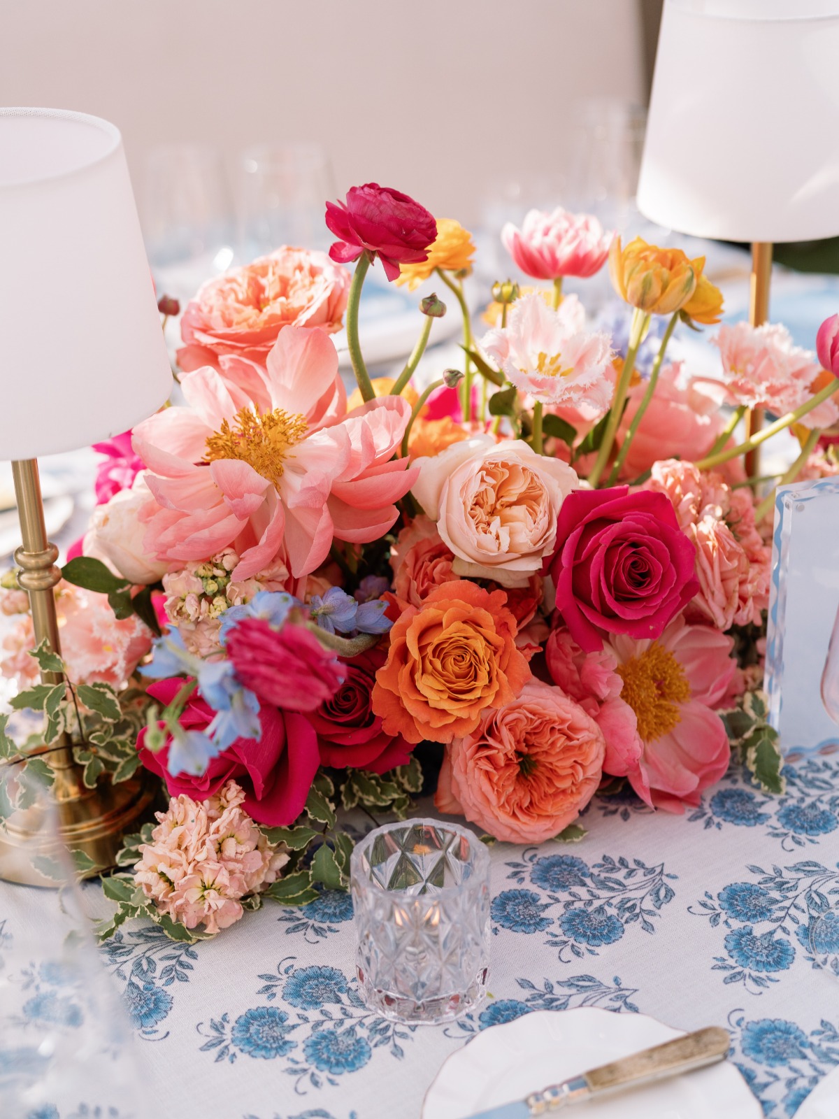colorful wedding tablescape with blue and white linens