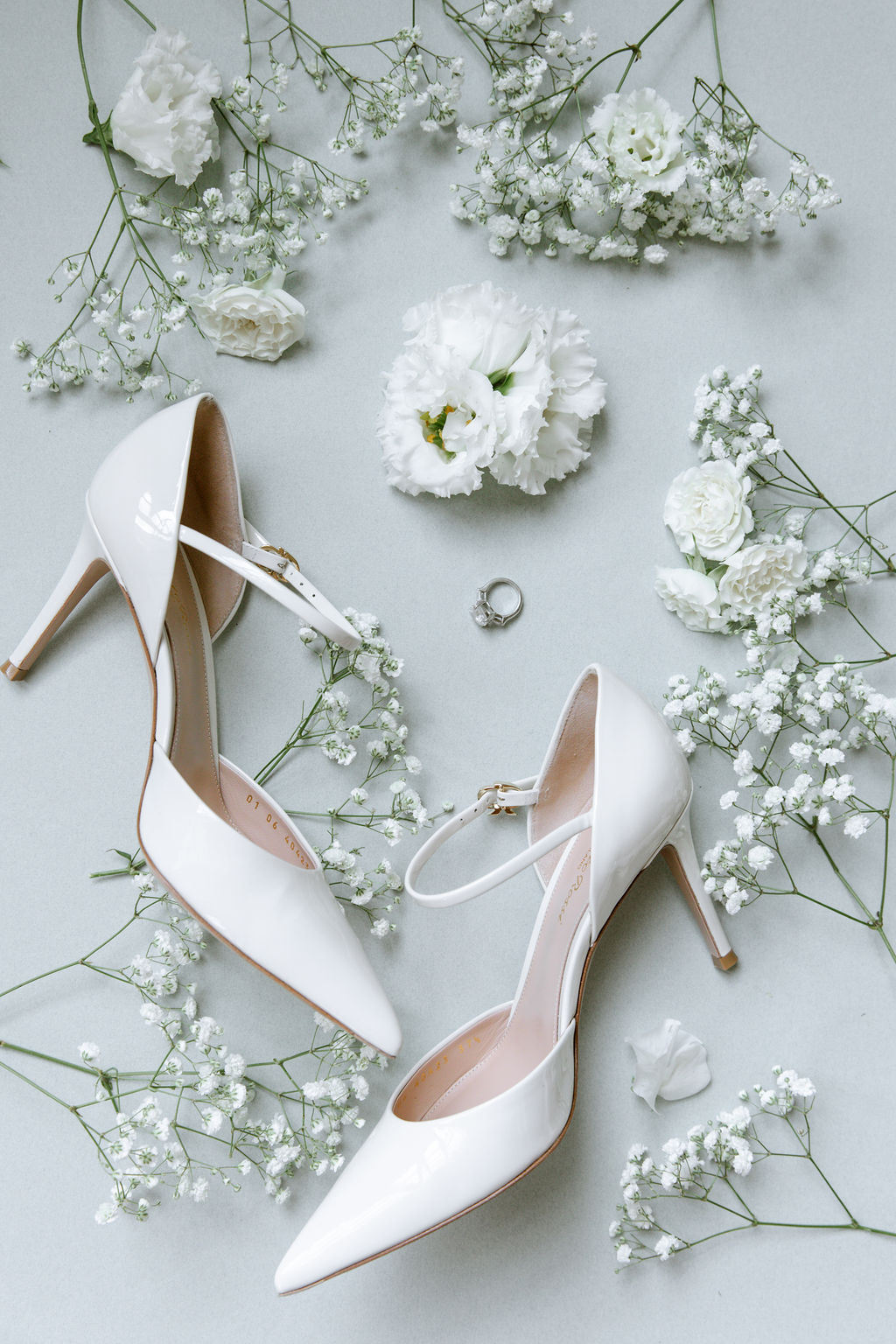 white patent leather bridal pumps