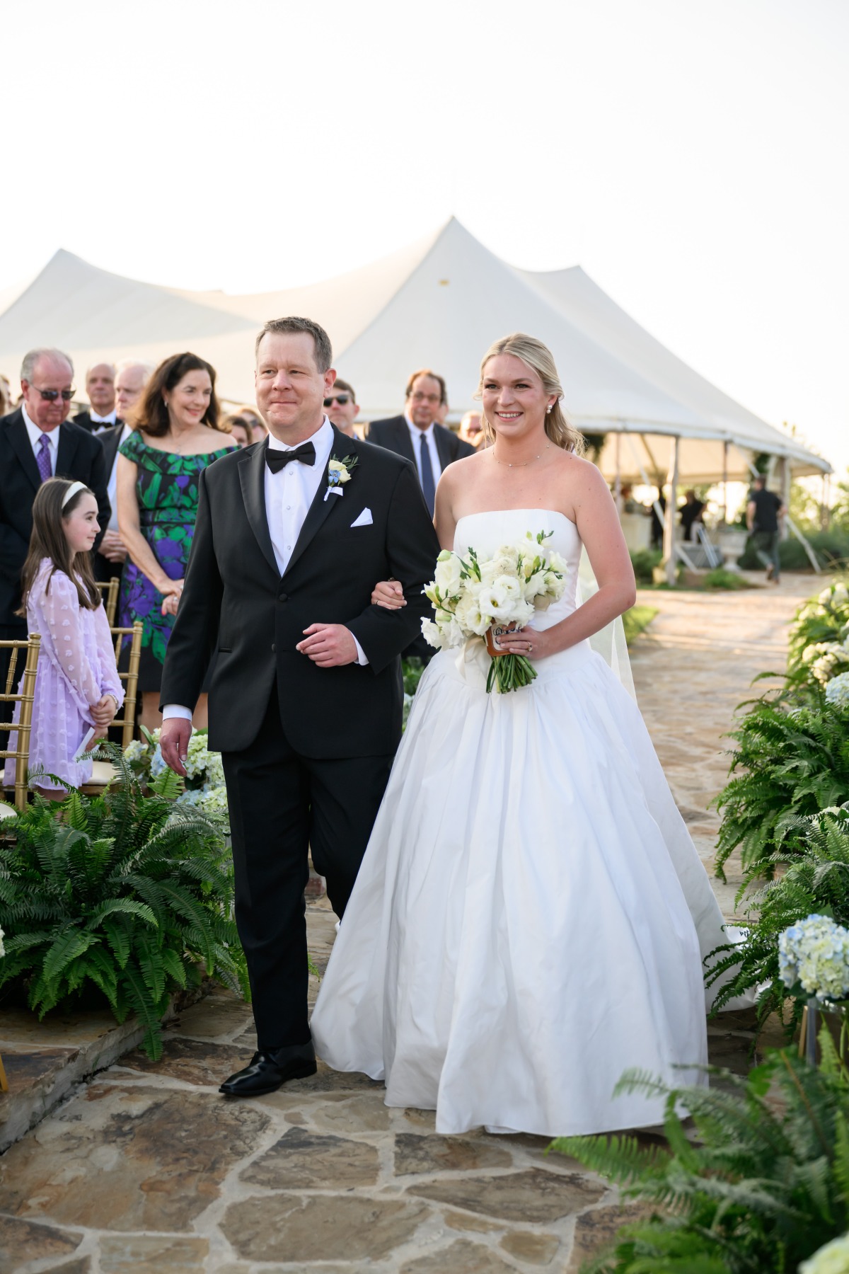 father of the bride walking her down the aisle