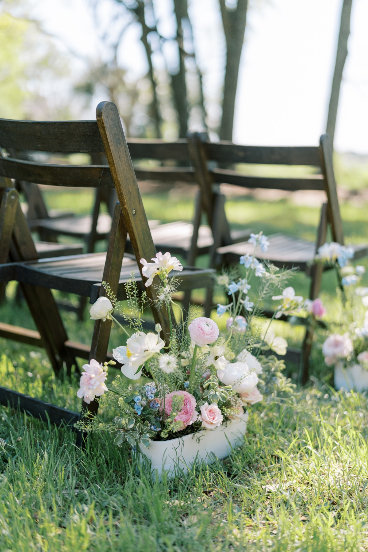 whimsical mini floral arrangements for aisle