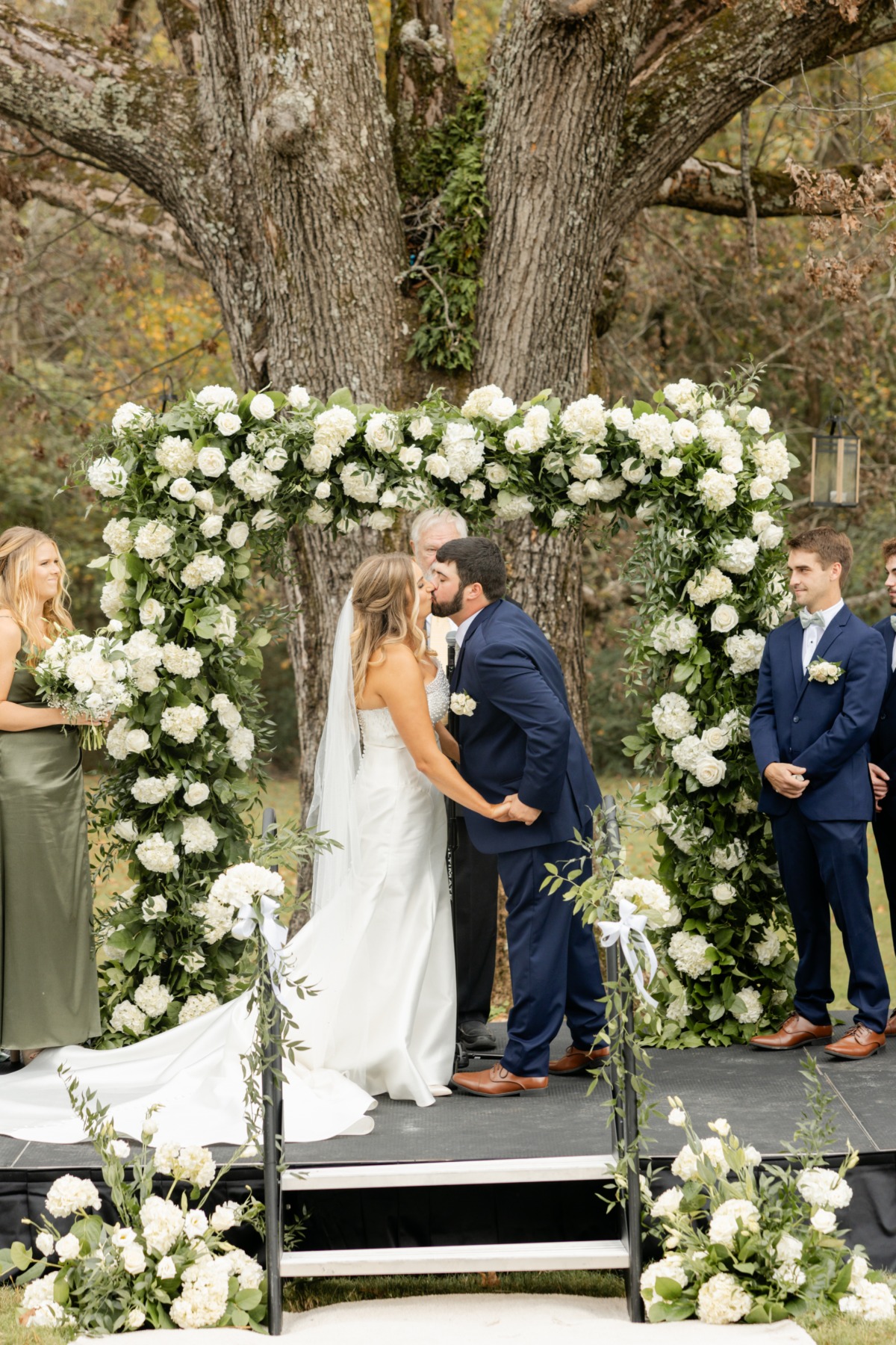 white floral arch for wedding