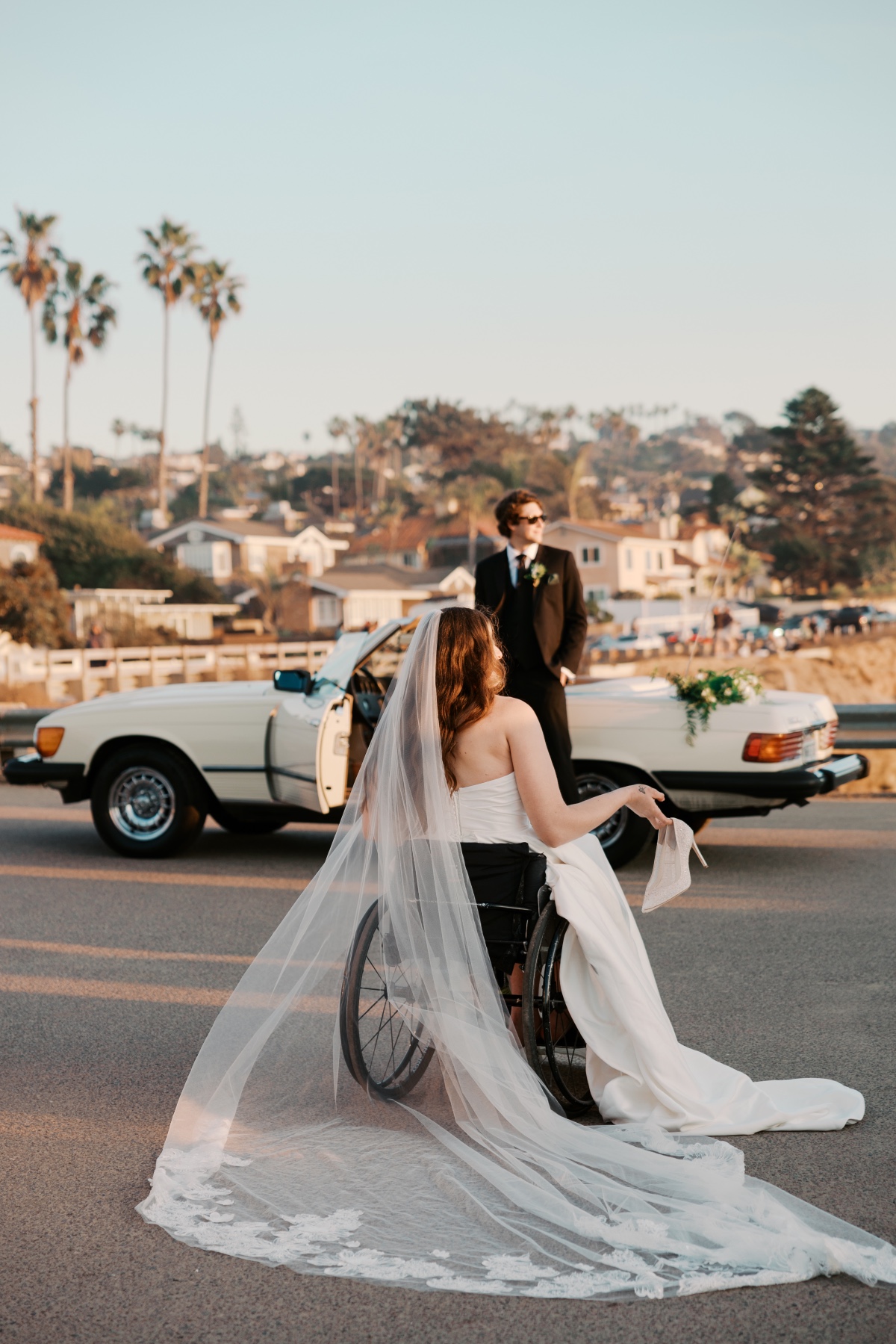 bride in wheelchair with convertible car