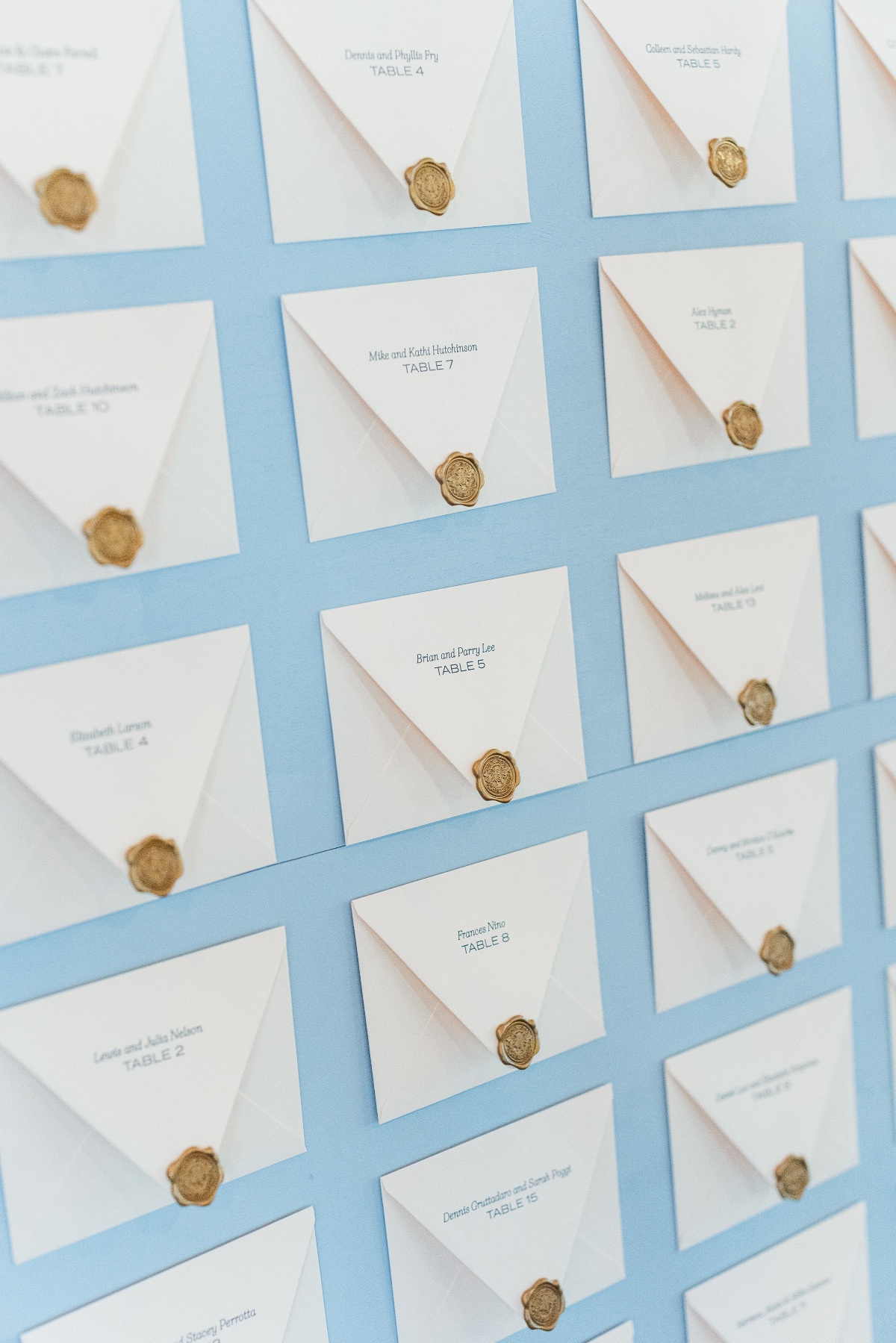 blue seating chart envelopes and gold custom wax seal