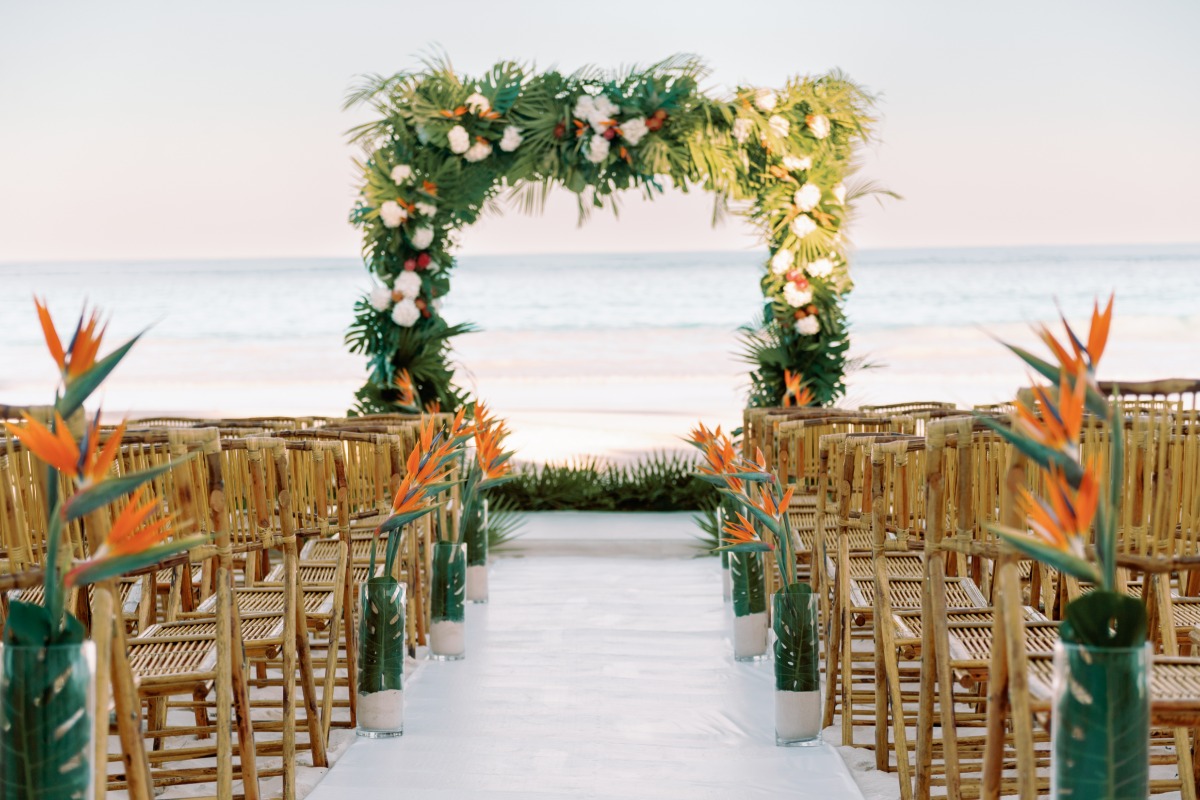monstera birds of paradise and hydrangea wedding ceremony florals