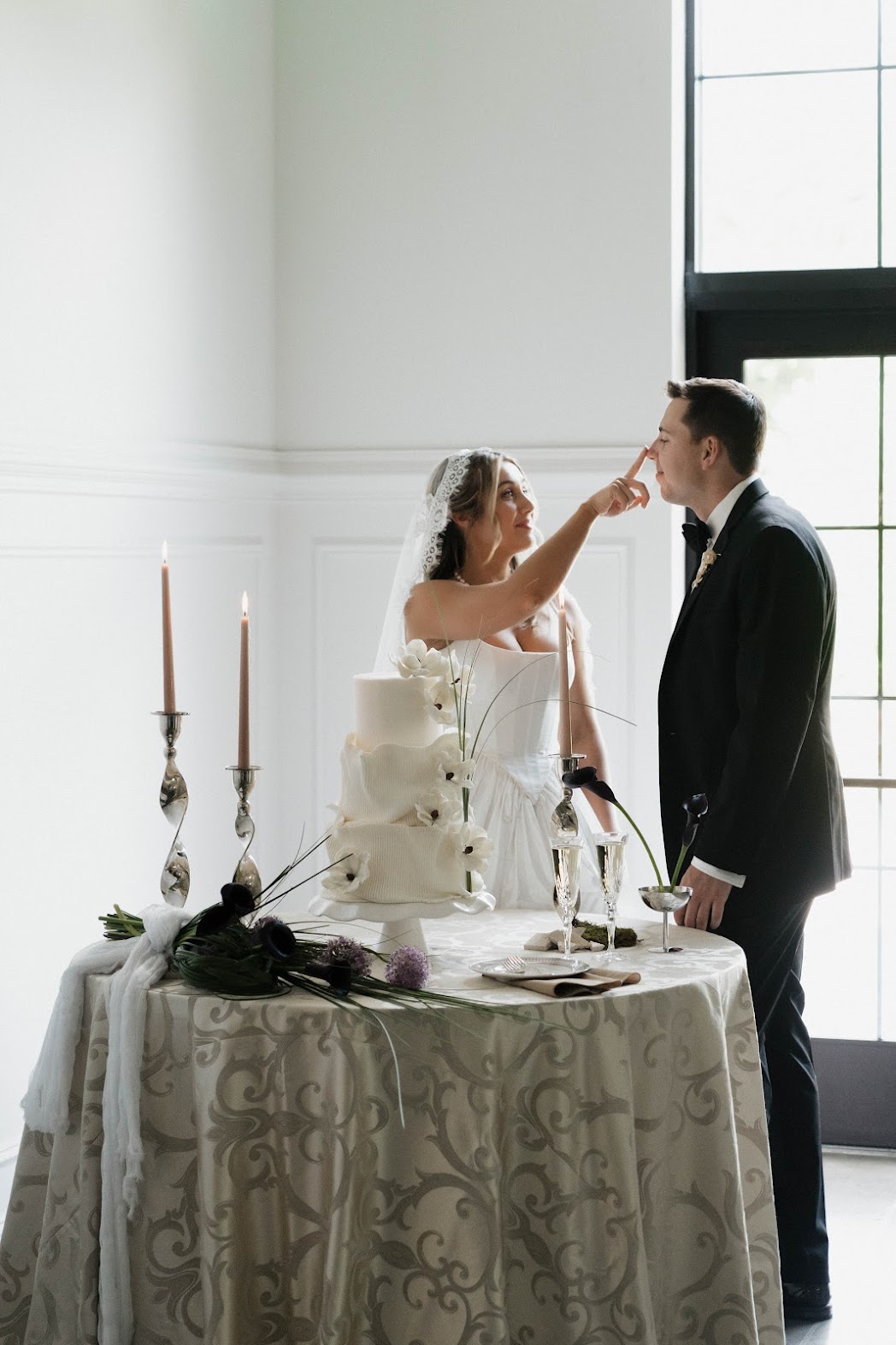 white wedding cake with anemones