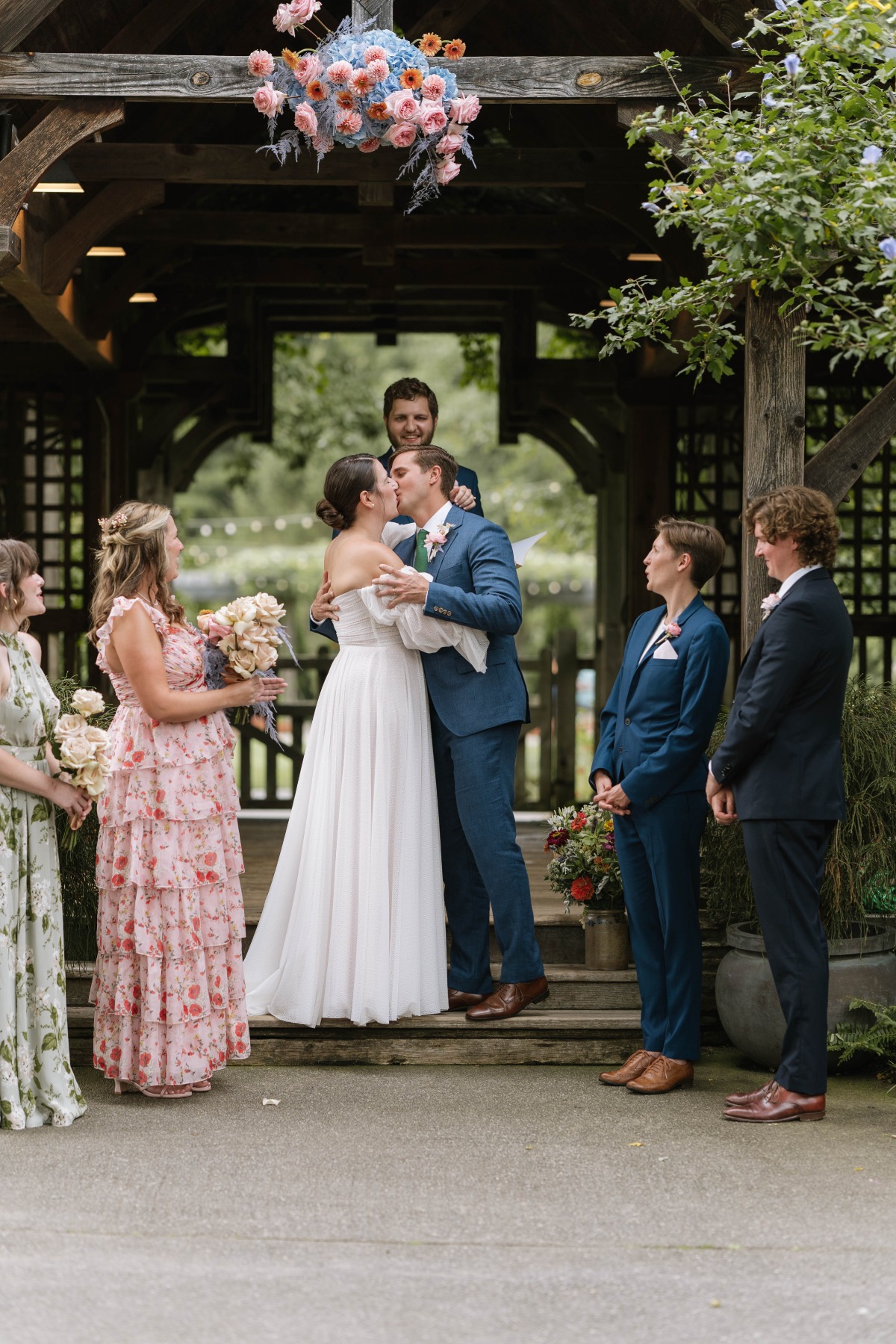 bridesmaids in floral print pastel dresses