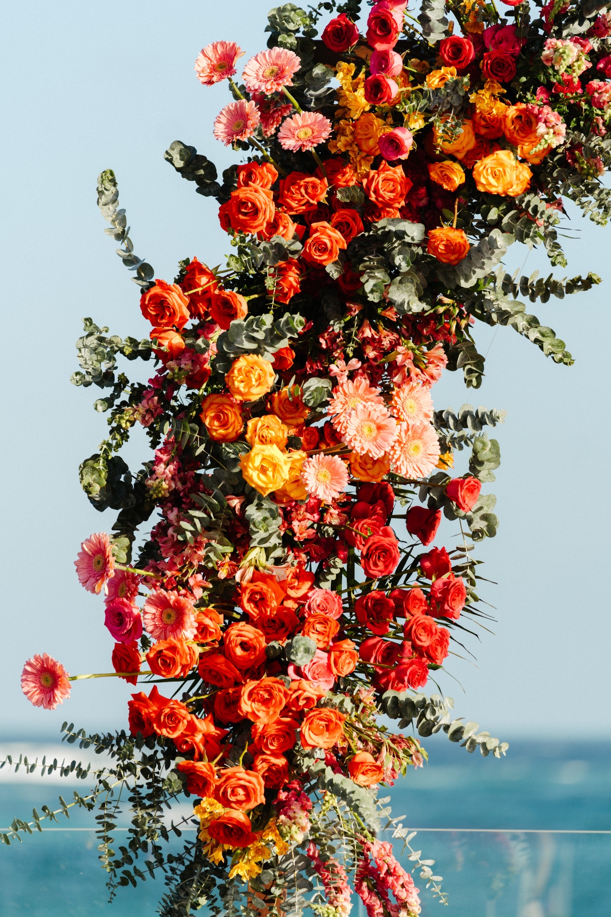 vibrant rose floral arch