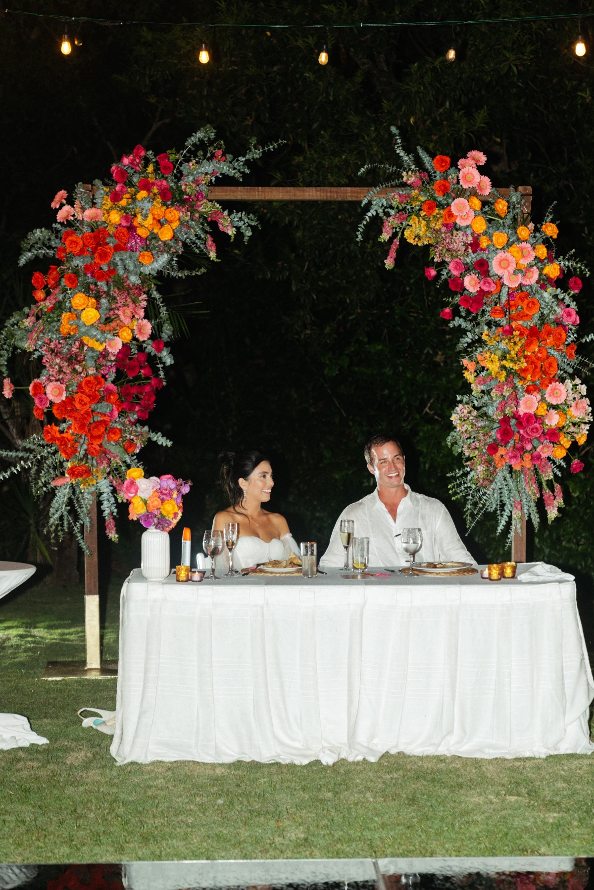 repurposing floral arch for sweetheart table