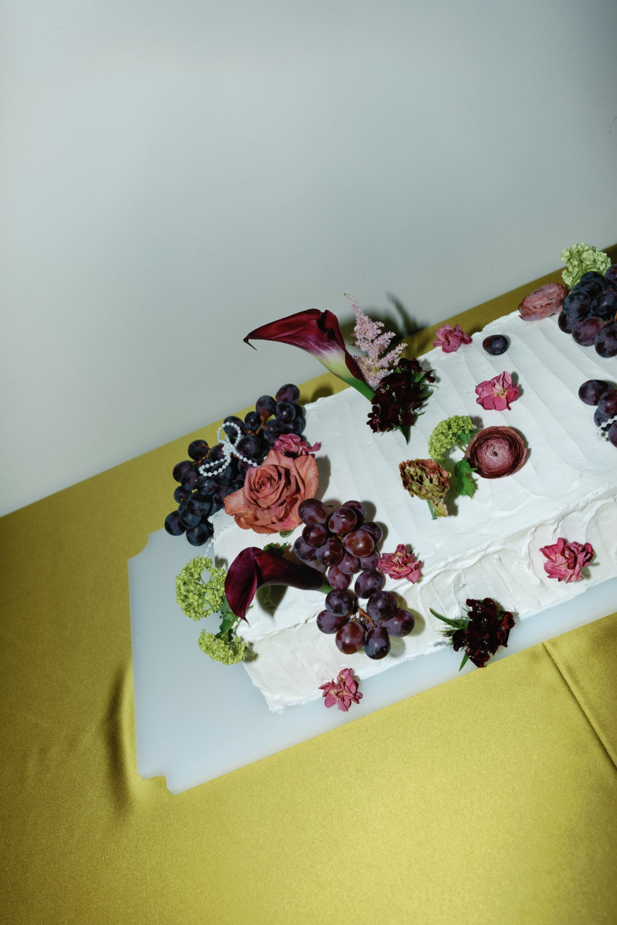 sheet cake with fresh flowers and grapes