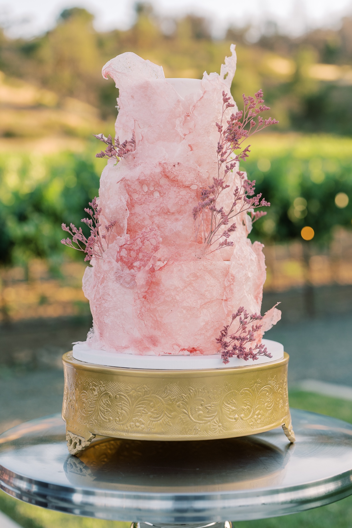 abstract pink dried flower wedding cake
