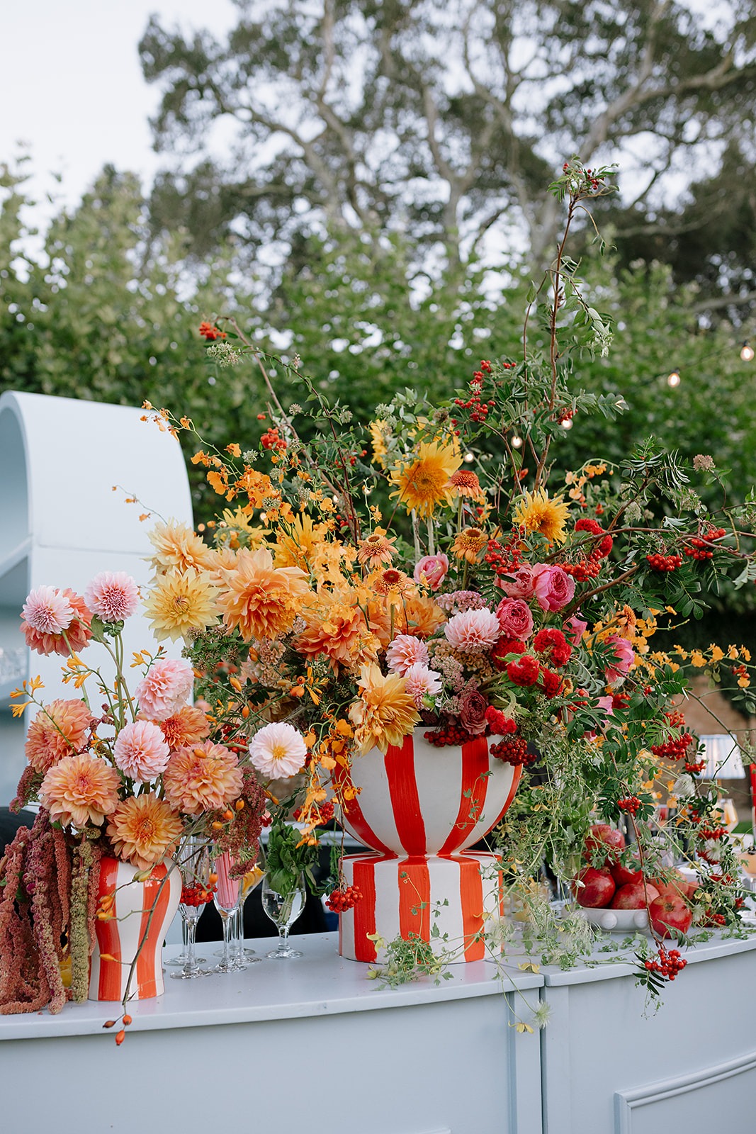 colorful wildflower arrangements in striped vases