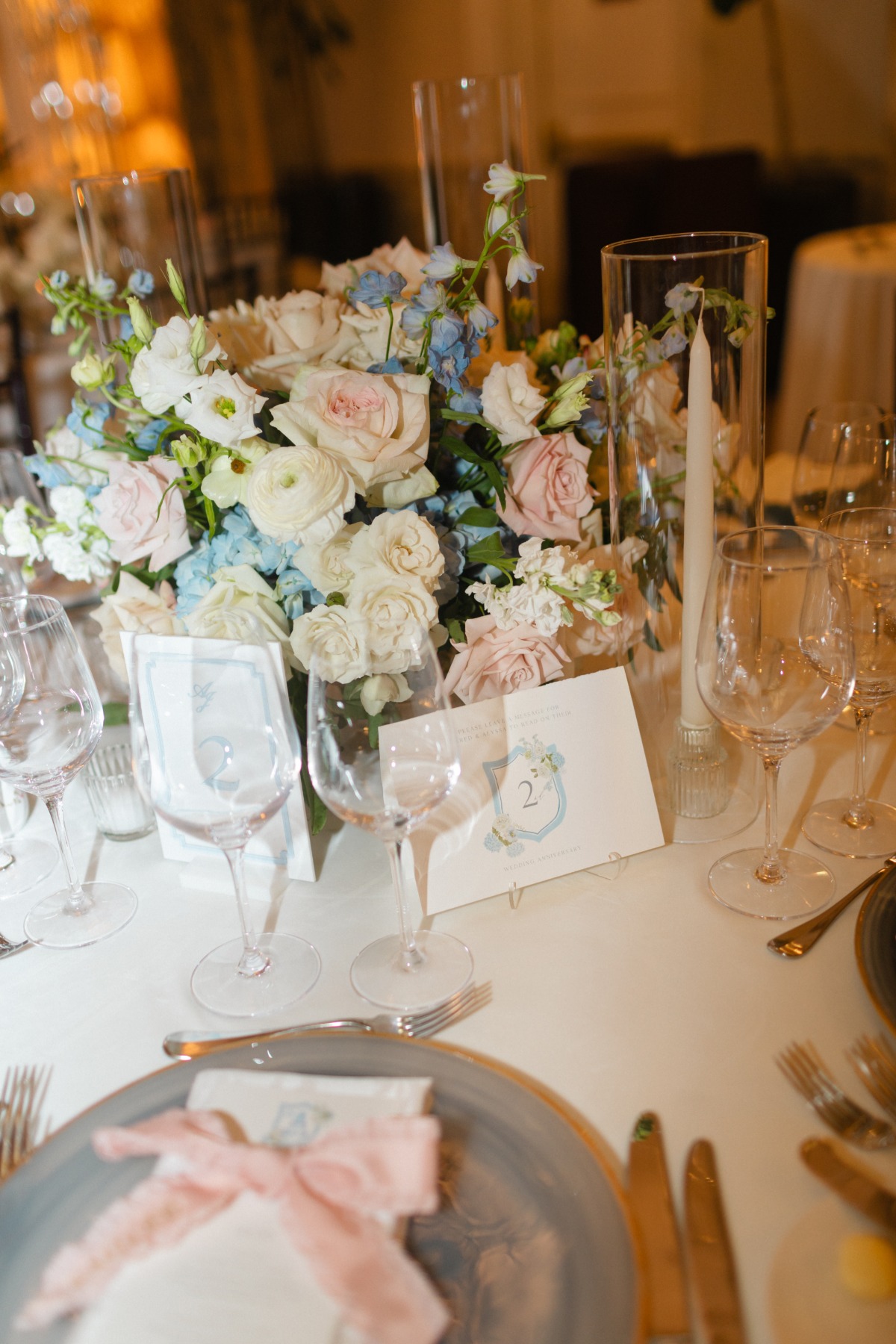pink rose and delphinium centerpieces
