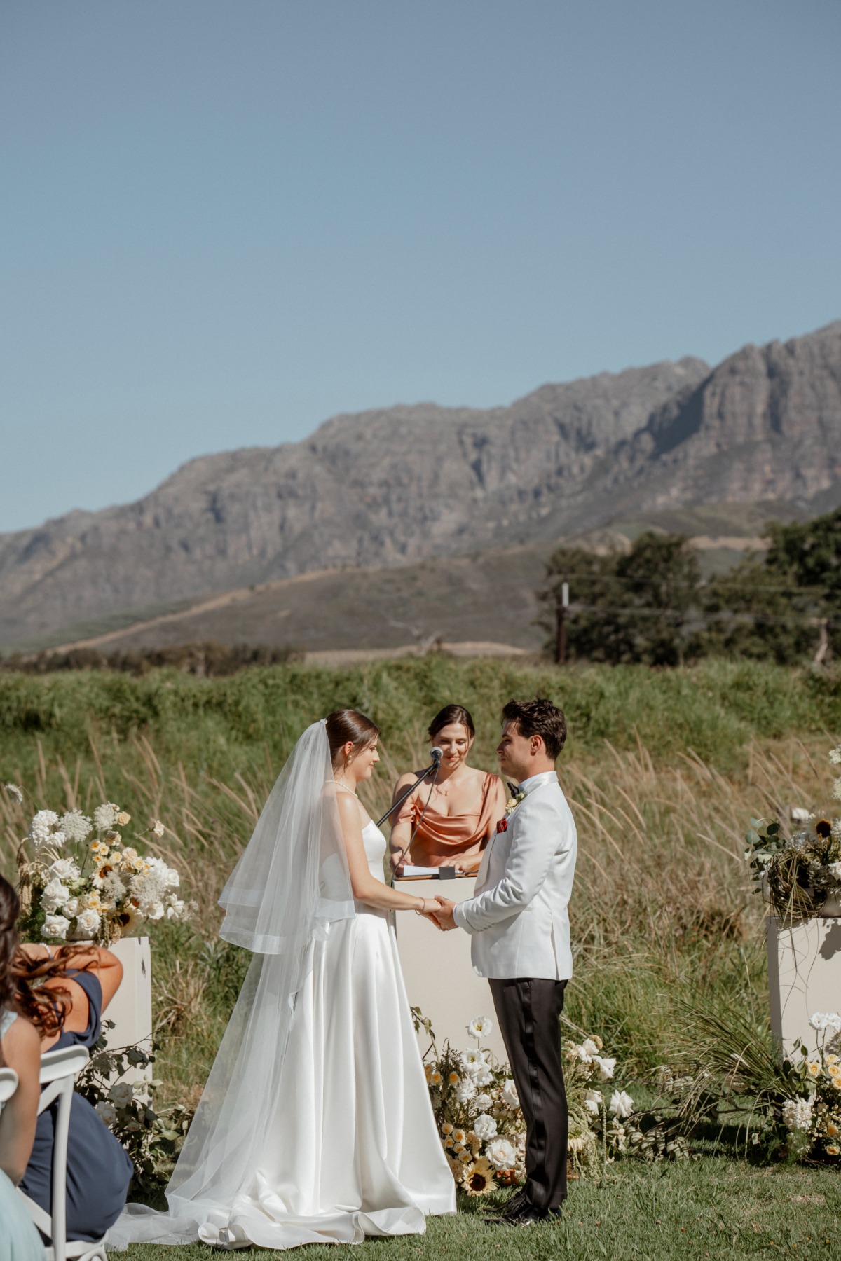 ceremony in front of mountain range