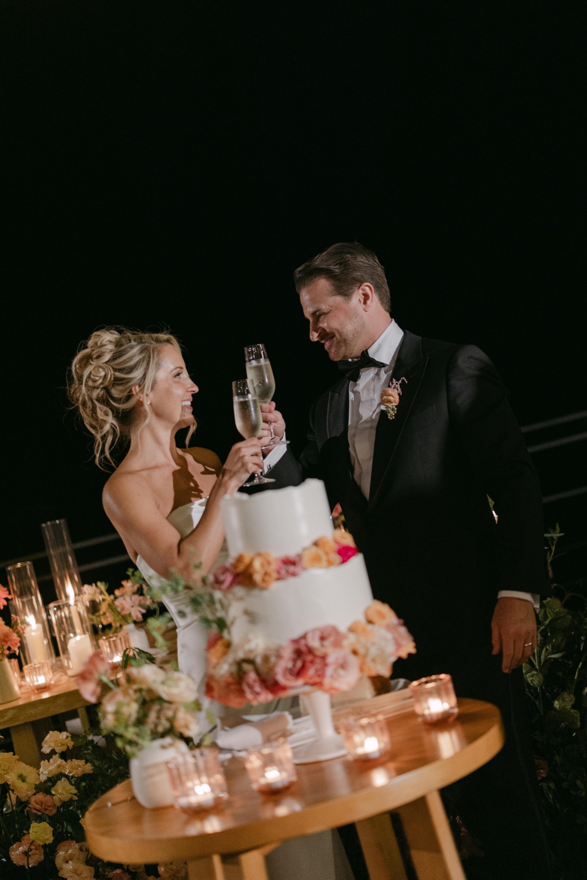 pink floral accented wedding cake
