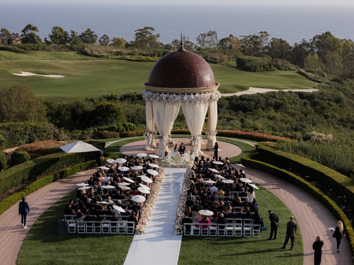 outdoor wedding ceremony with parasols