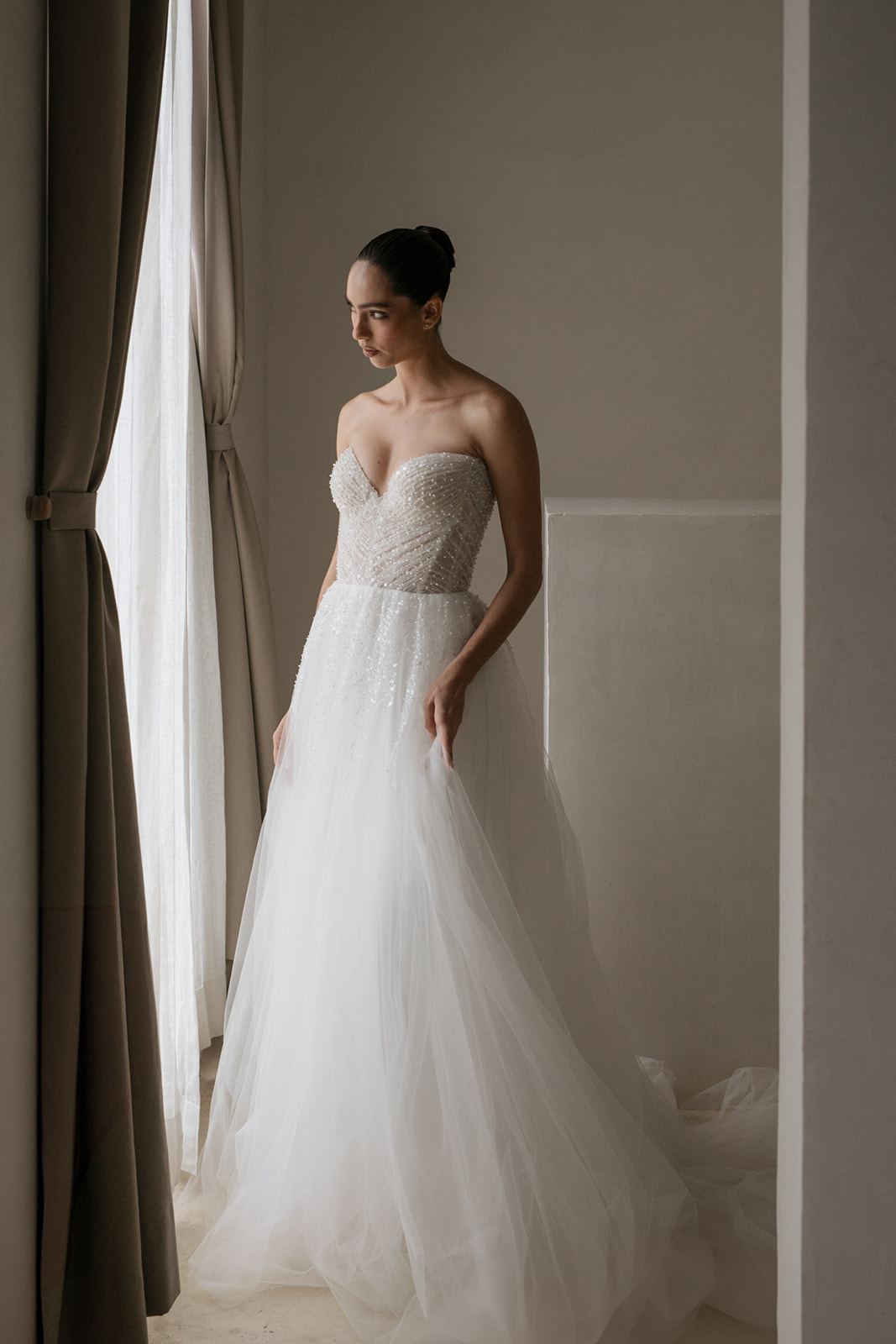 wedding dress with beaded top and tulle skirt