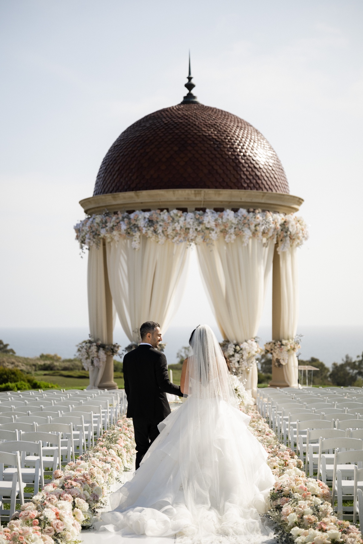 floor to ceiling wedding ceremony flowers in neutrals
