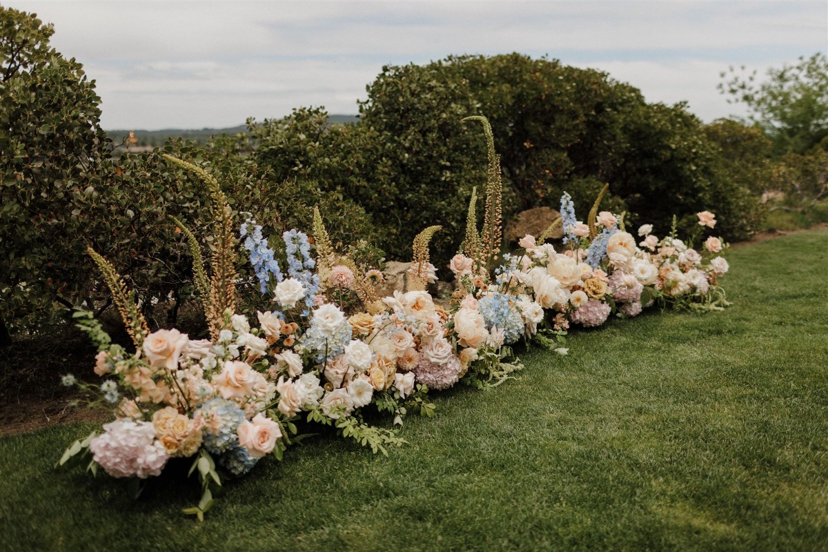 peach and blue wedding ceremony flowers