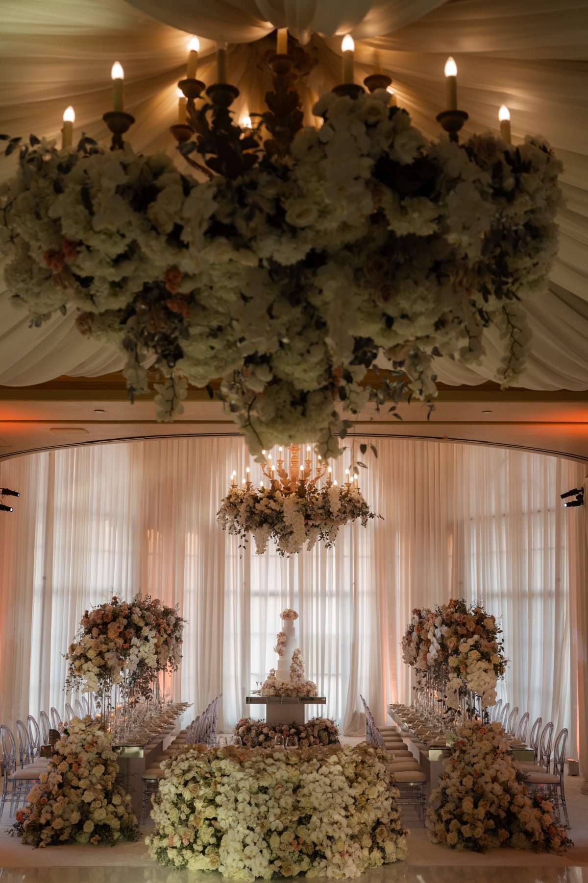large floral installations with white draping