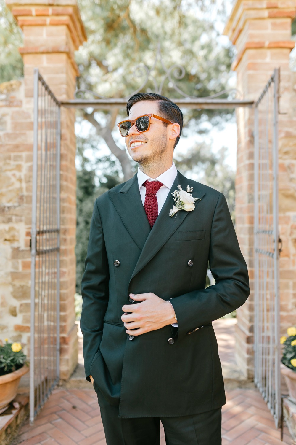 groom in double breasted green suit
